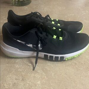Black and White Nike Shoes with Green Accents
